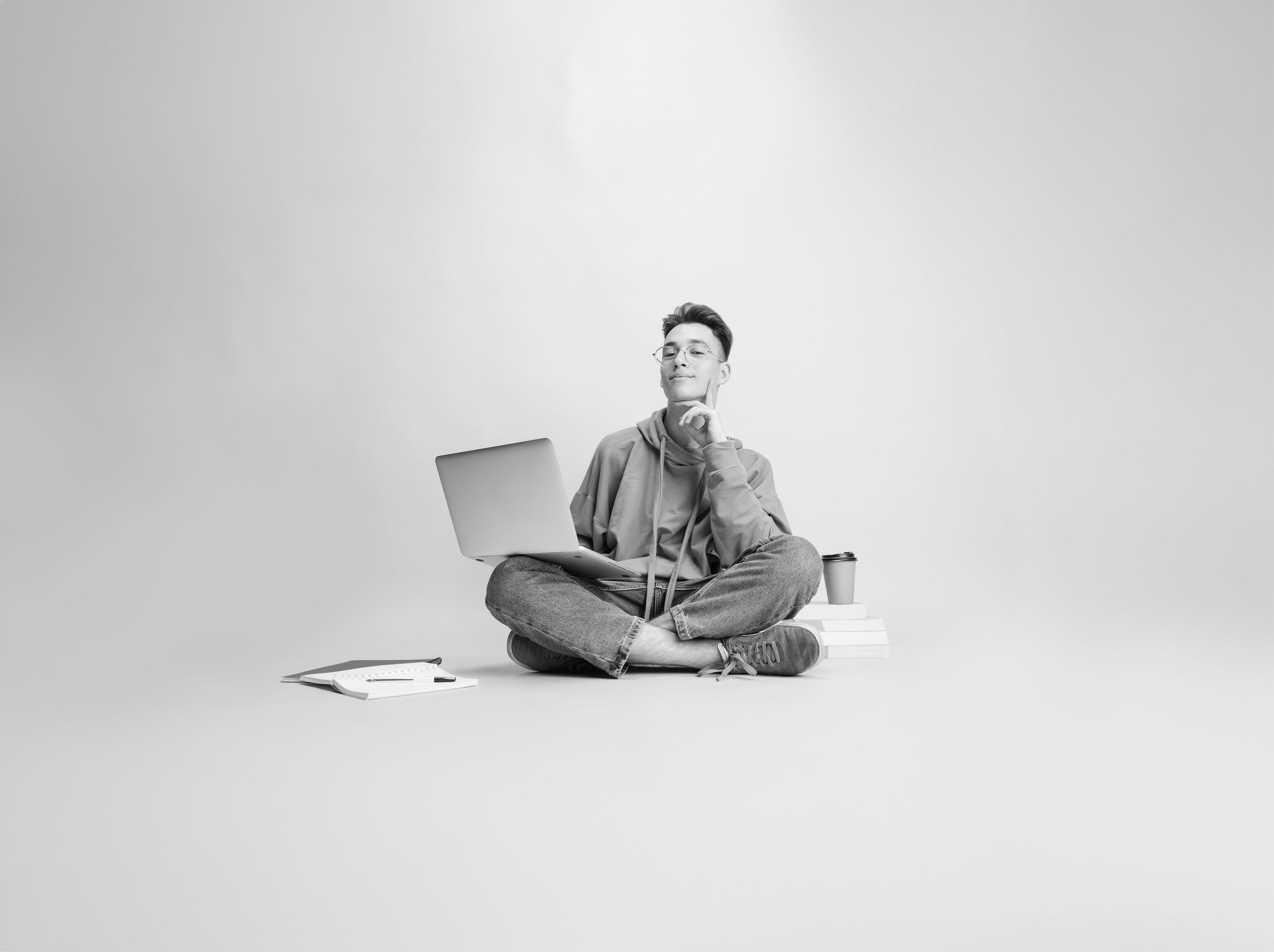 Student sitting with laptop